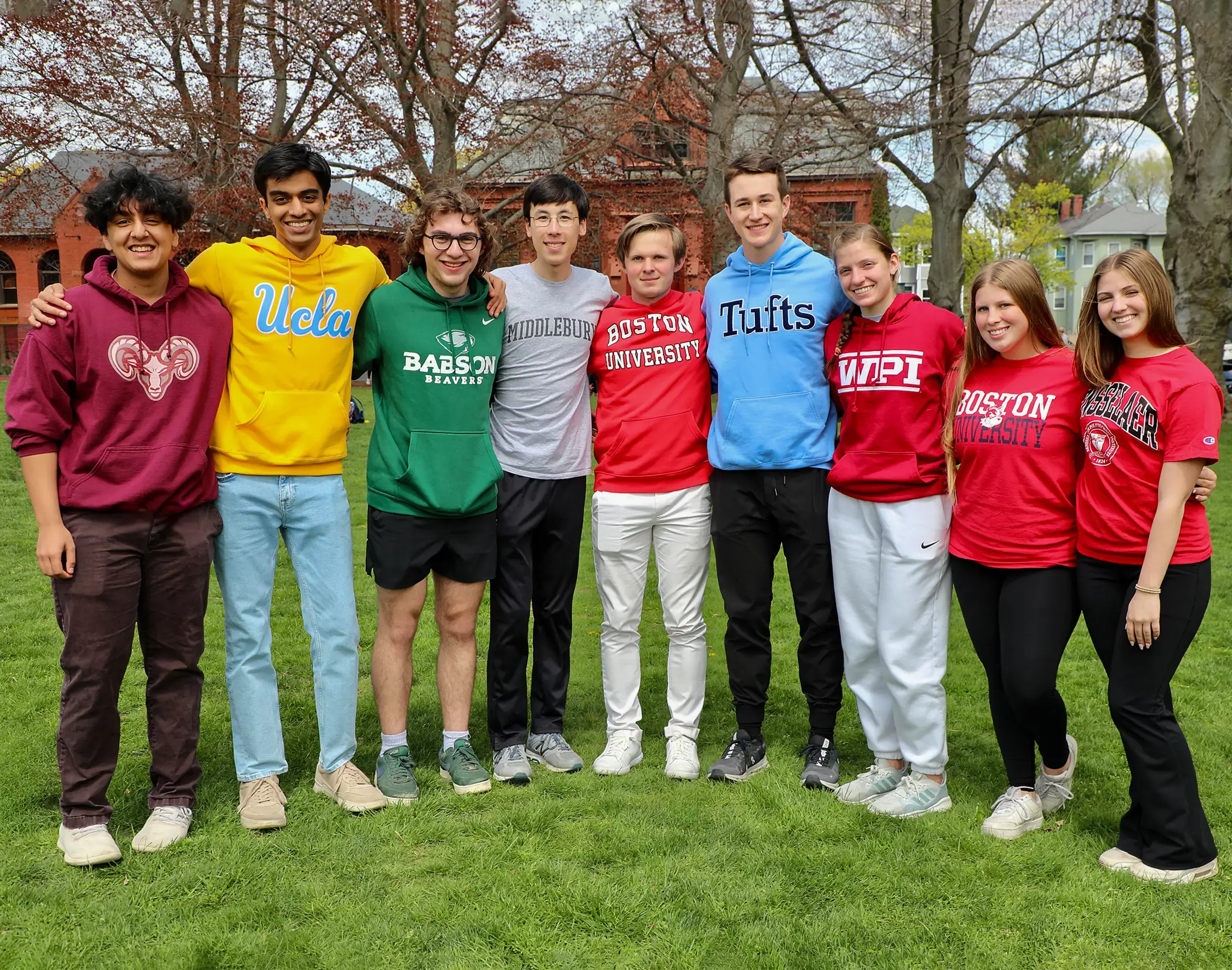 Students on the quad wearing college t-shirts.