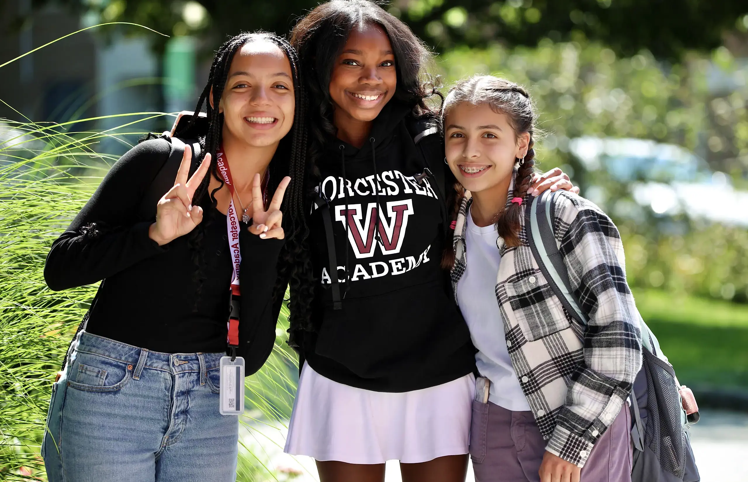 Worcester Academy Upper School students outside together smiling.