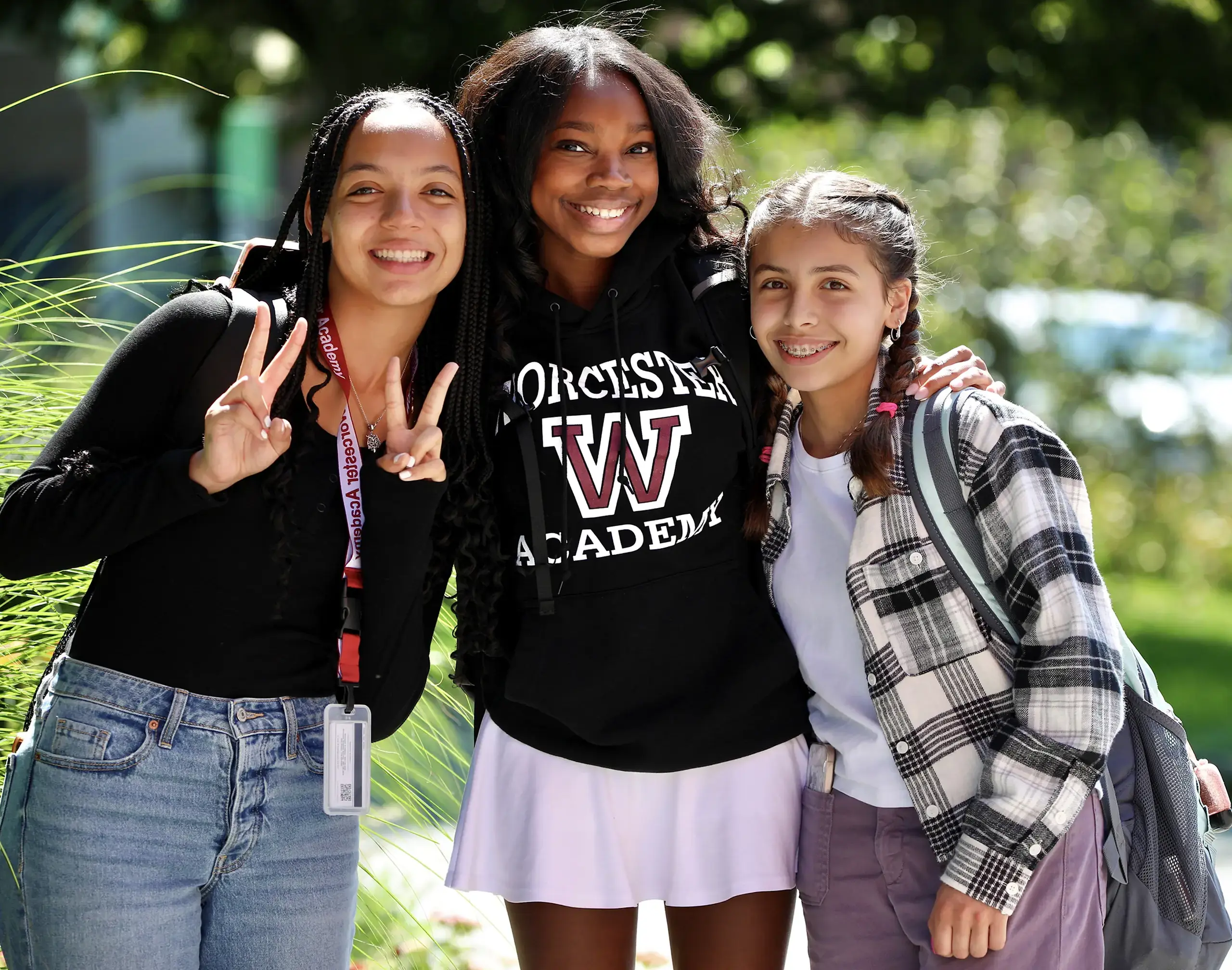 Worcester Academy Upper School students outside together smiling.