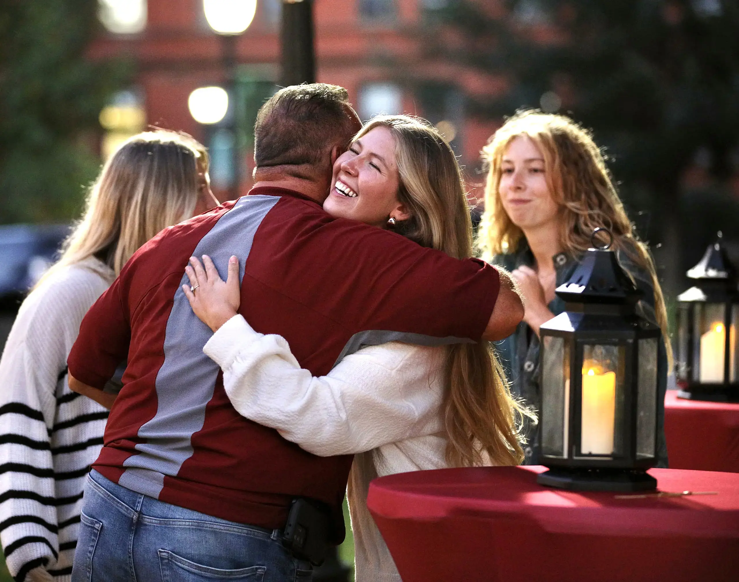 An alumna is hugging a former classmate at Alumni Reunion.