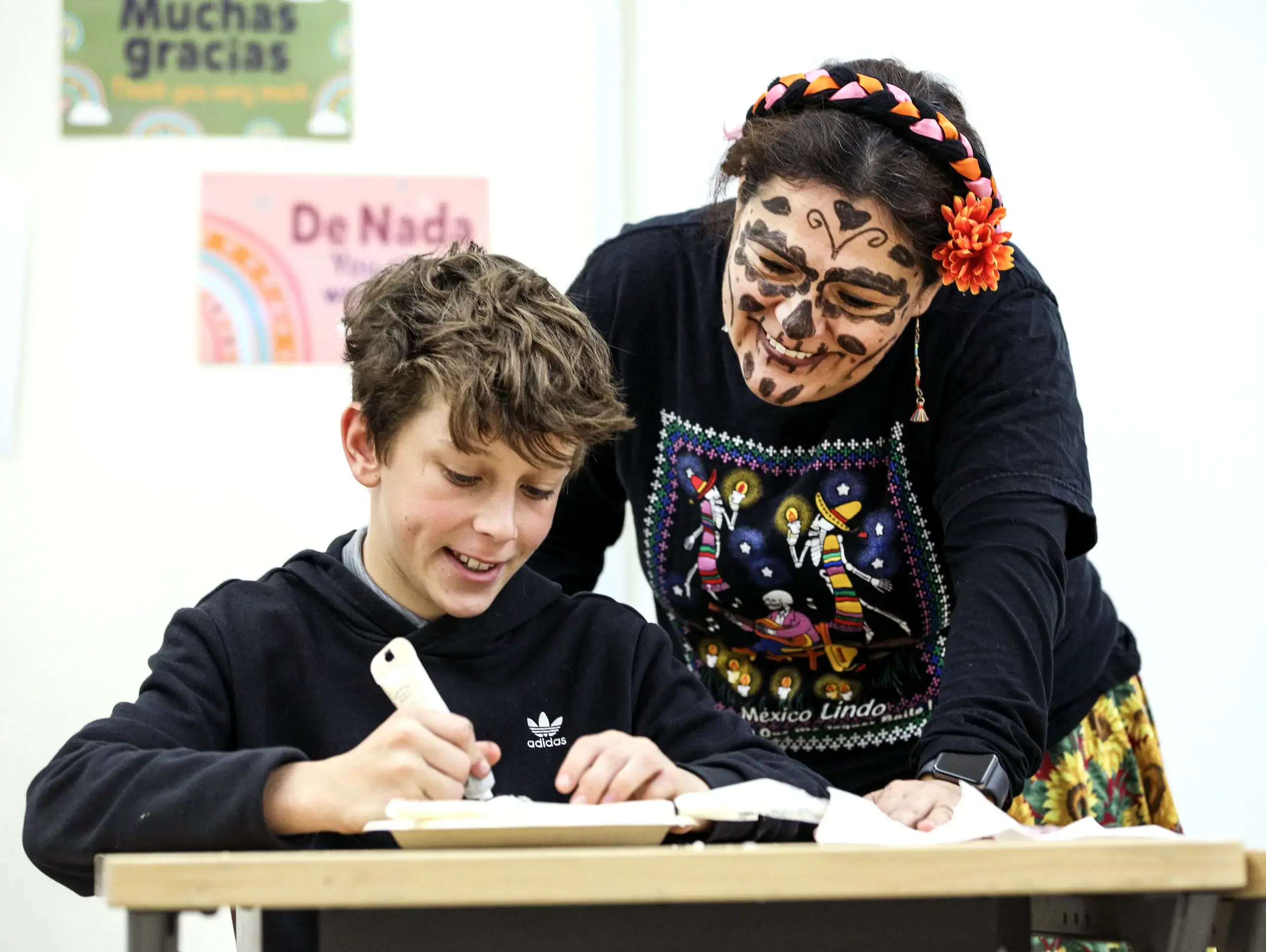 Middle School Teacher and student in World Language Class for Day of the Dead.