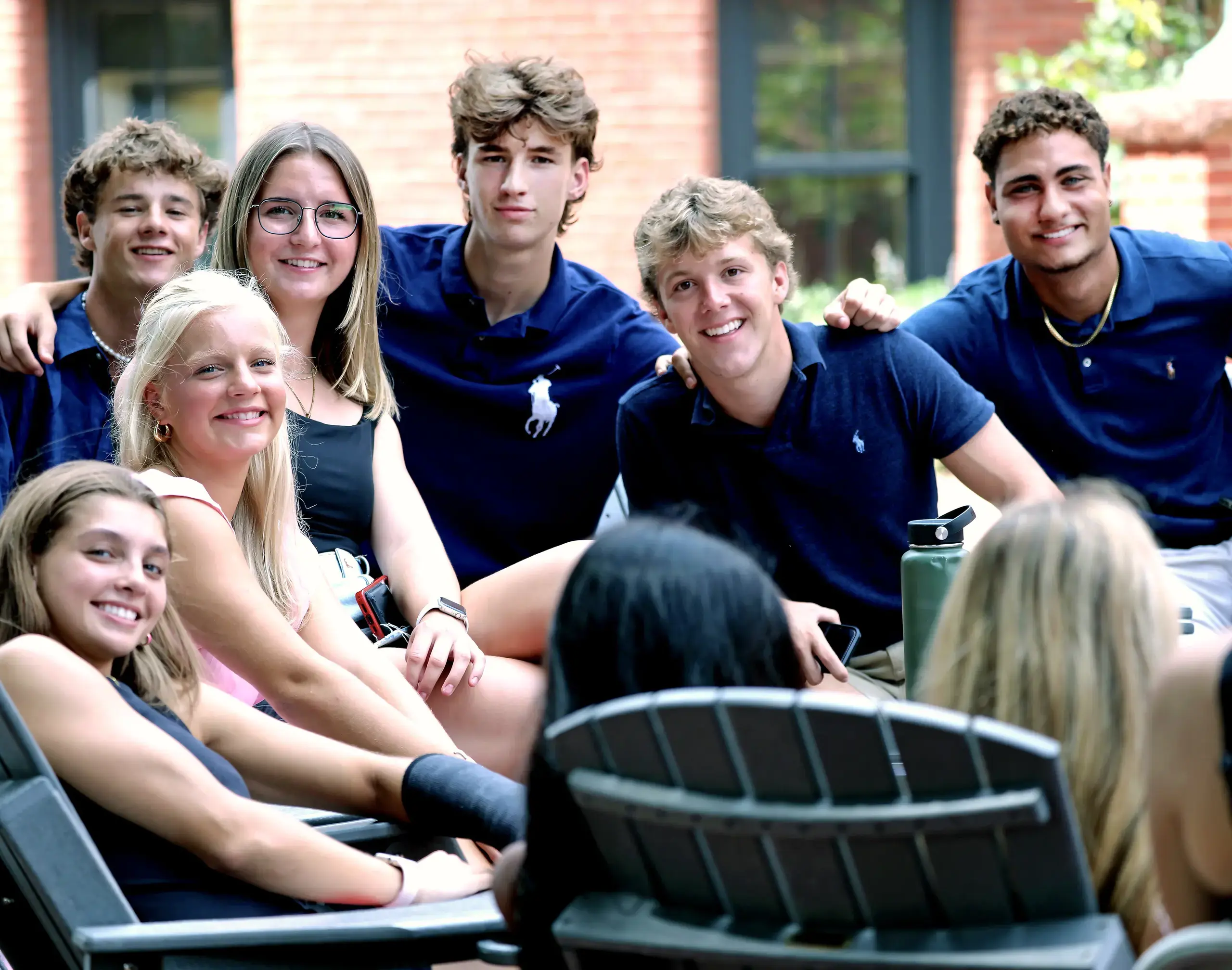 A group of Upper School students sitting together.