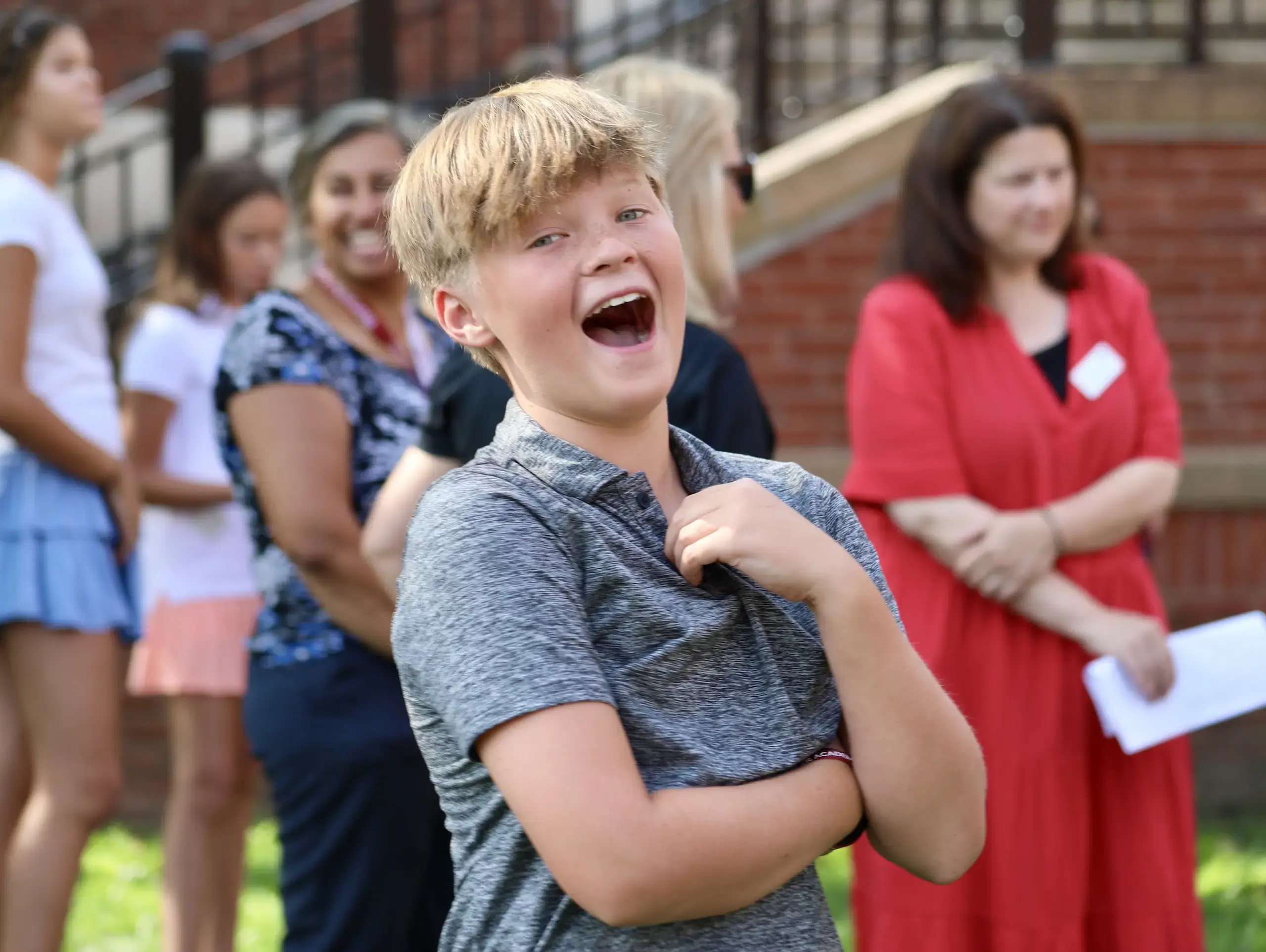 Middle School student outside laughing