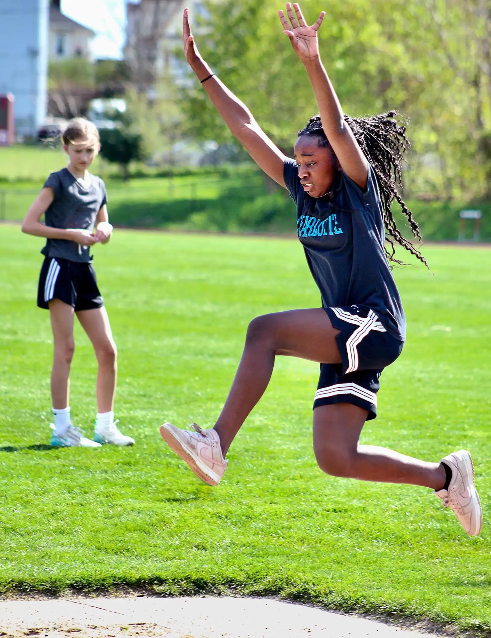 Worcester Academy Middle School student competing in the long jump.