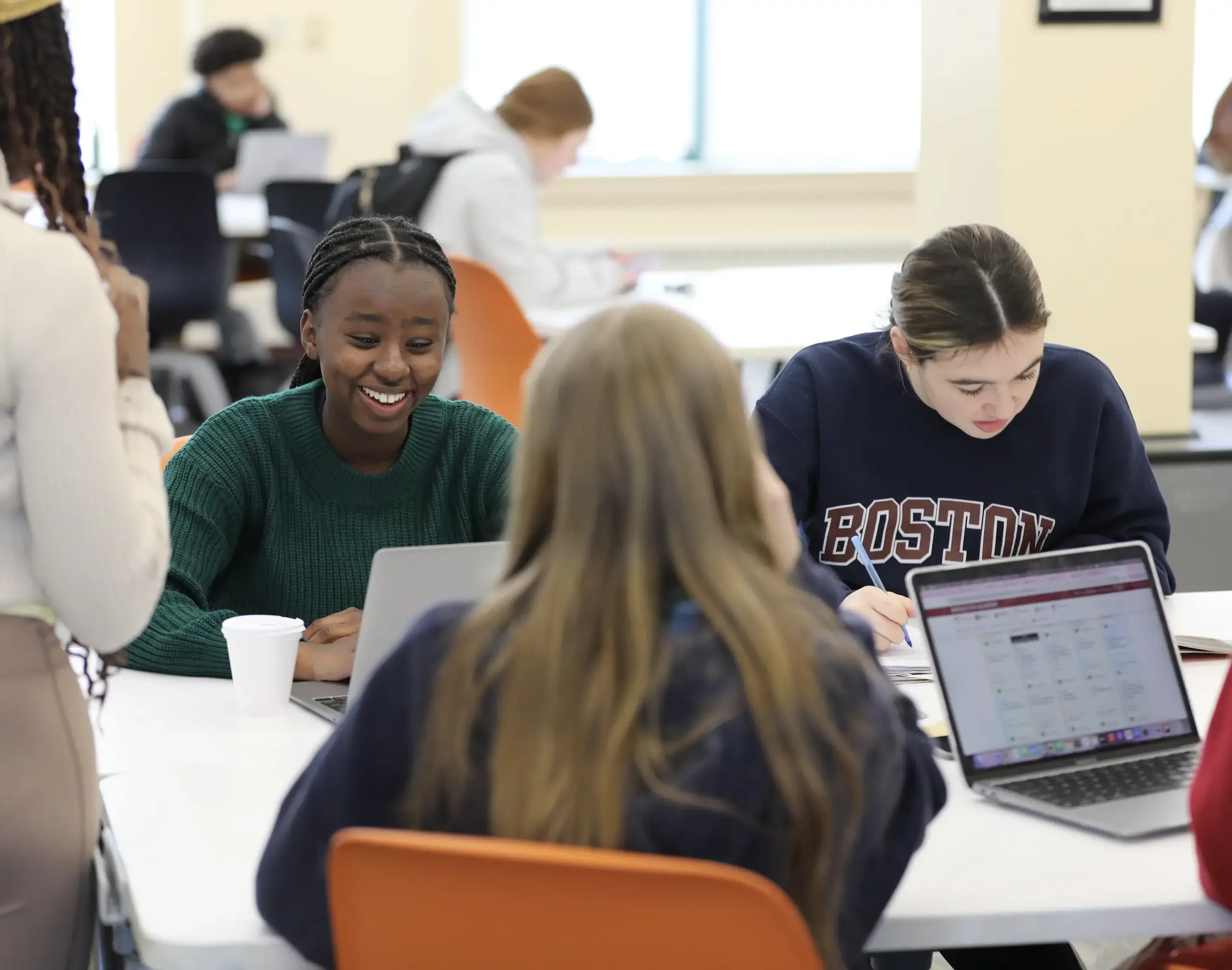 Students working together at a table.
