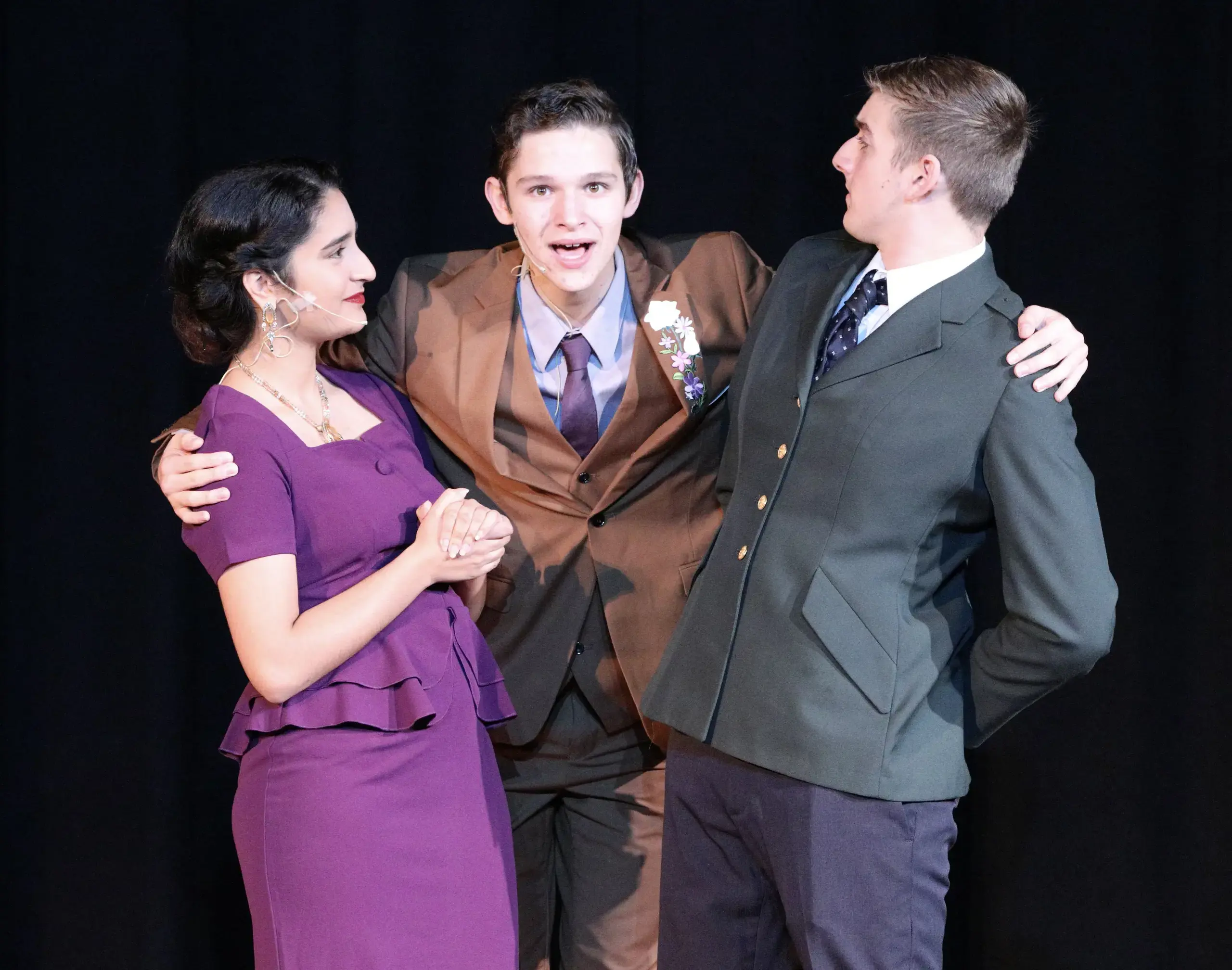 Three Worcester Academy Students performing in a theater production