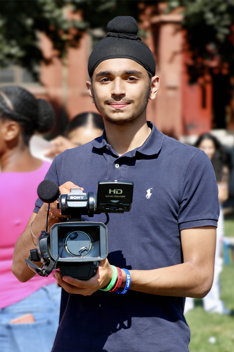 Aekem Singh ’26 with a camera.