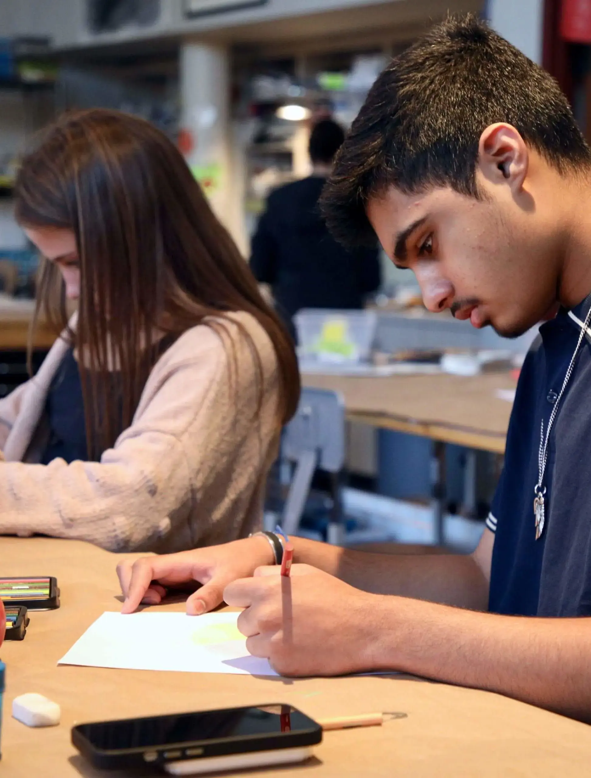 Worcester Academy Upper School student sketching an apple in a Visual Arts class.