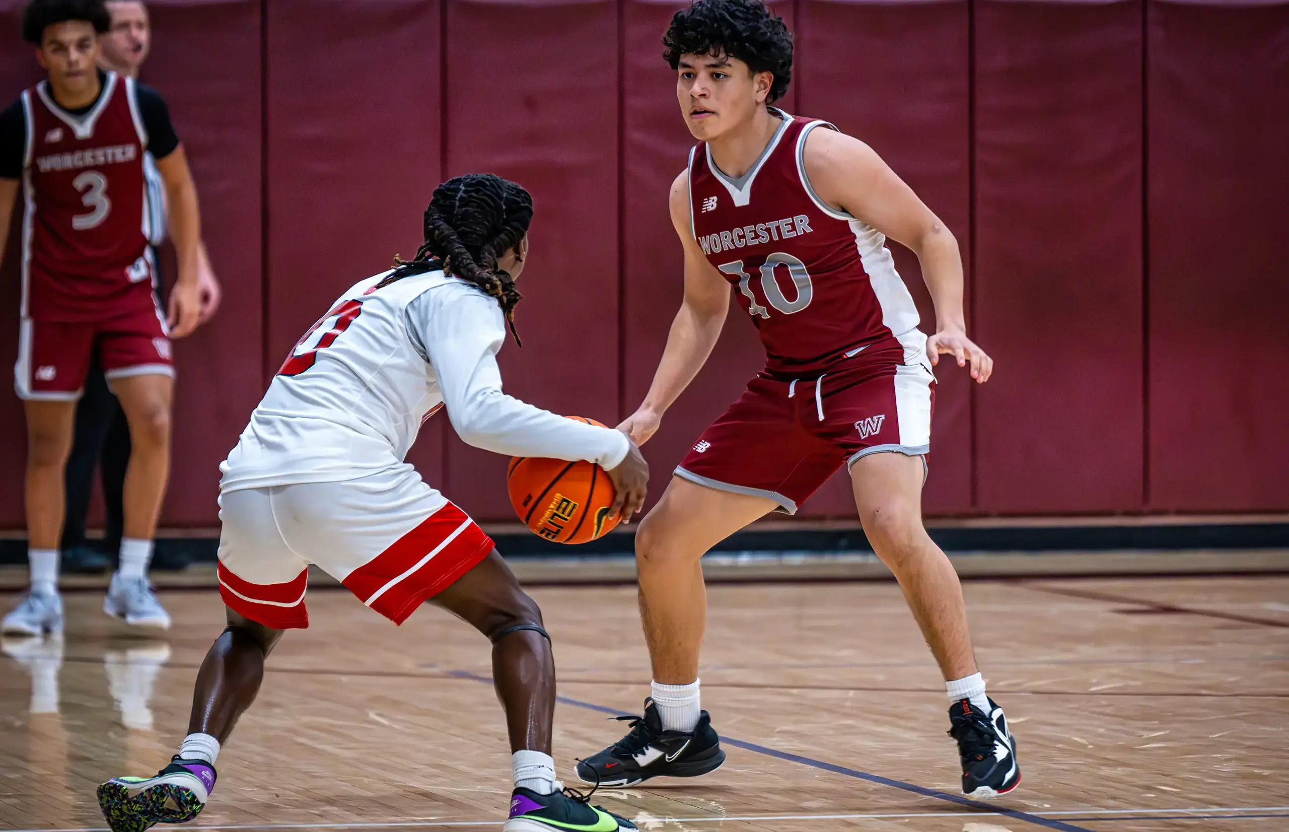 Worcester Academy Student playing basketball.