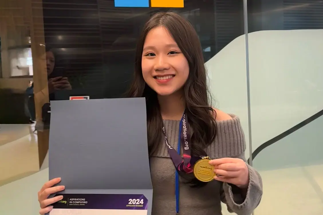 Ruby Tran ’26 with a computer