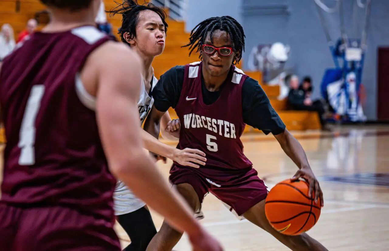 Worcester Academy Student playing basketball.