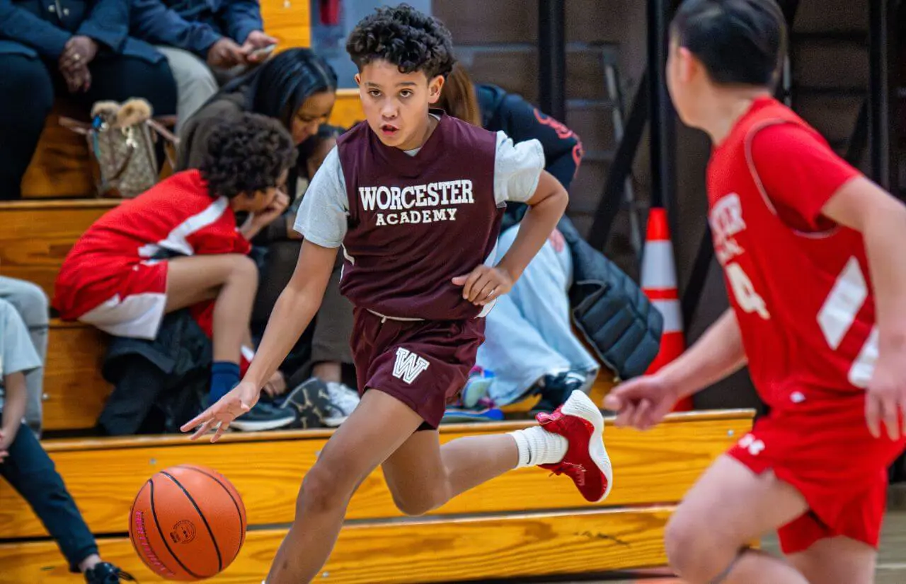 Worcester Academy Student playing basketball.