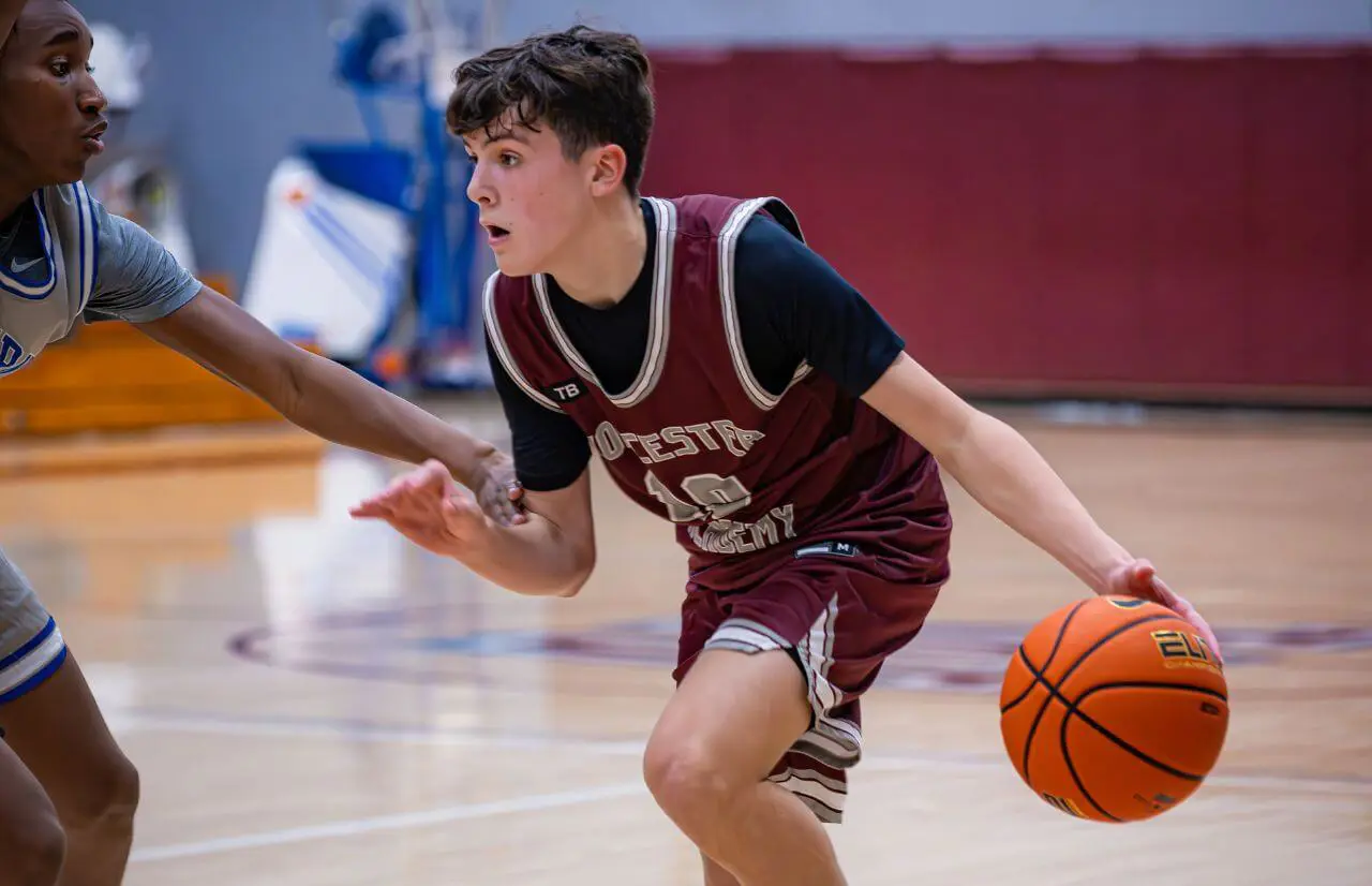 Worcester Academy Student playing basketball.