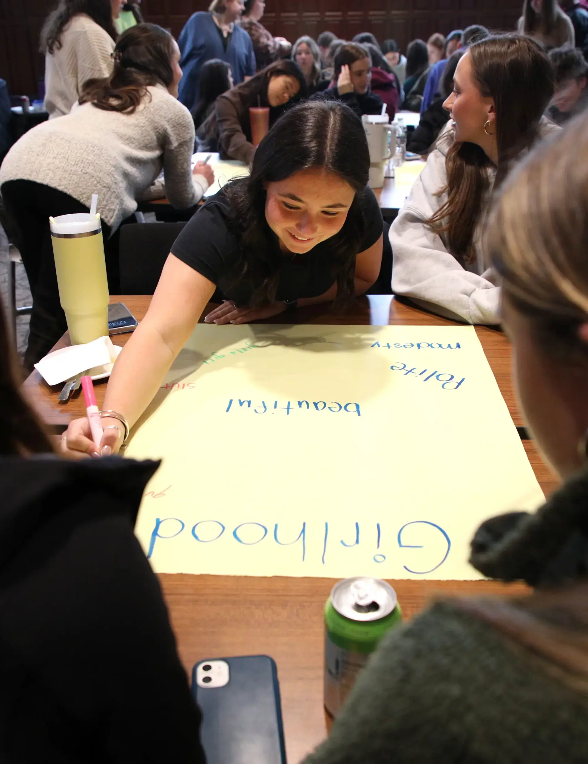 Lilly McCarty ’25 making a poster