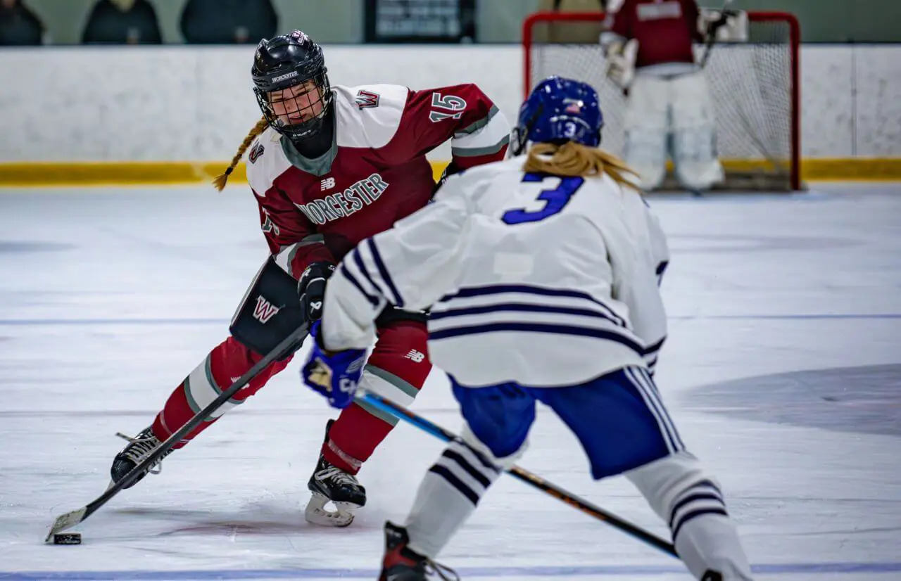 Worcester Academy Student playing hockey.