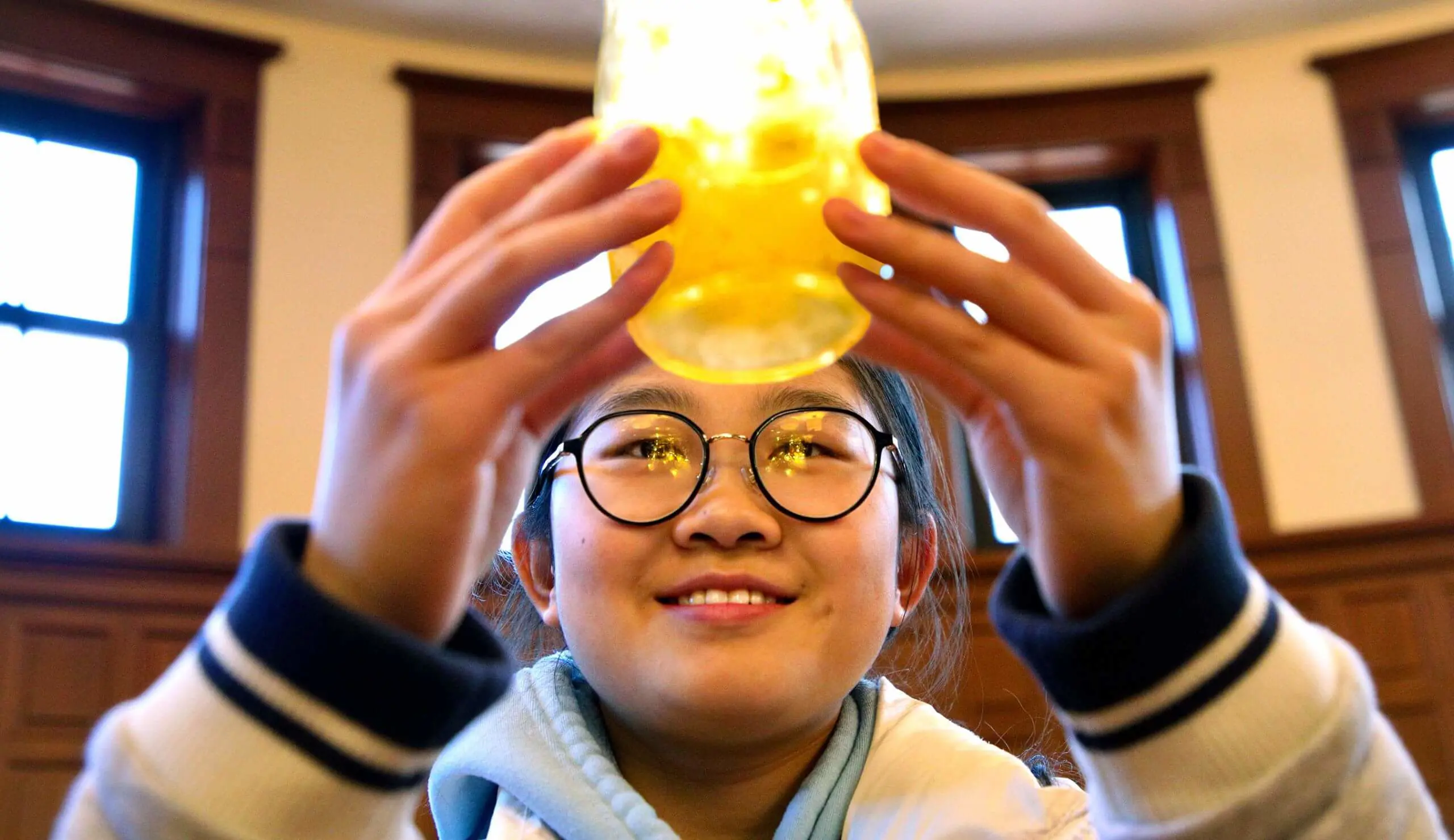 Worcester Academy student holding Pillars light.