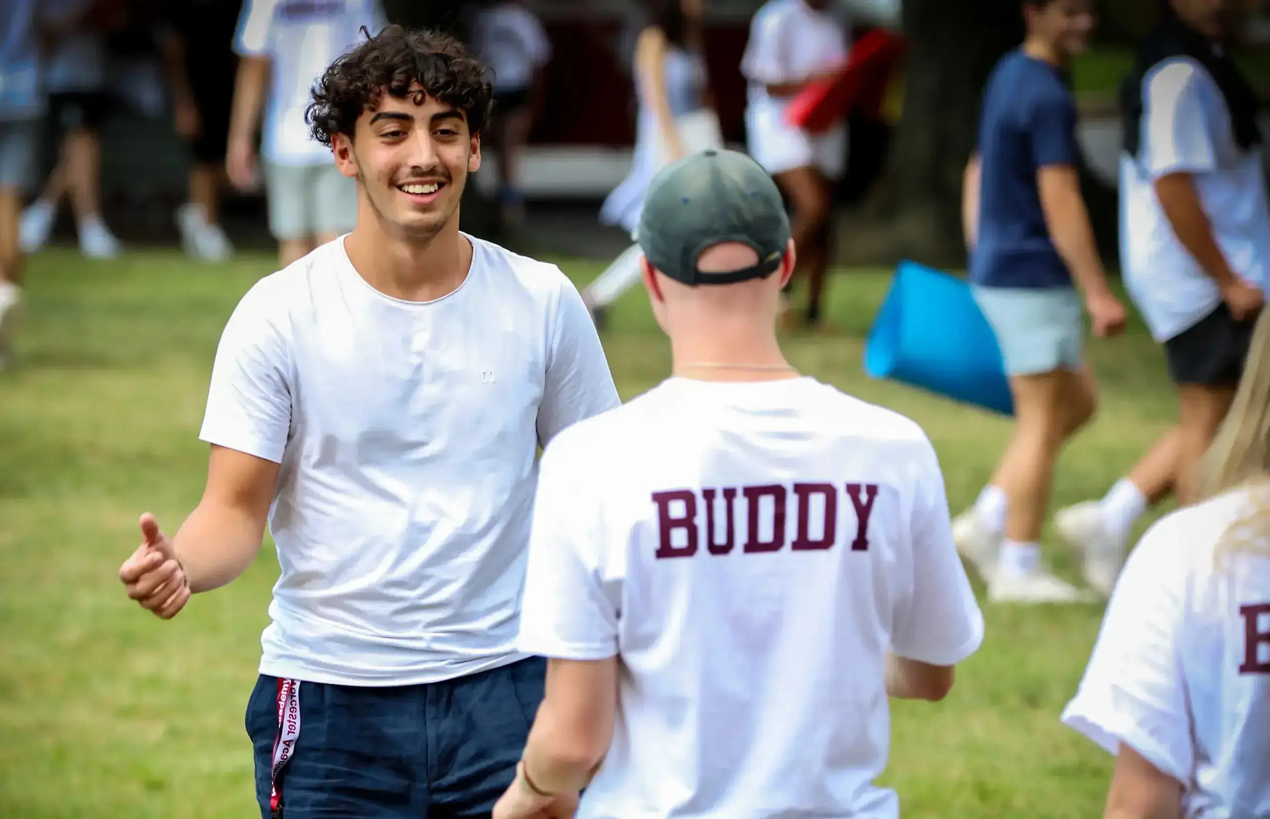 Two students about to shake hands