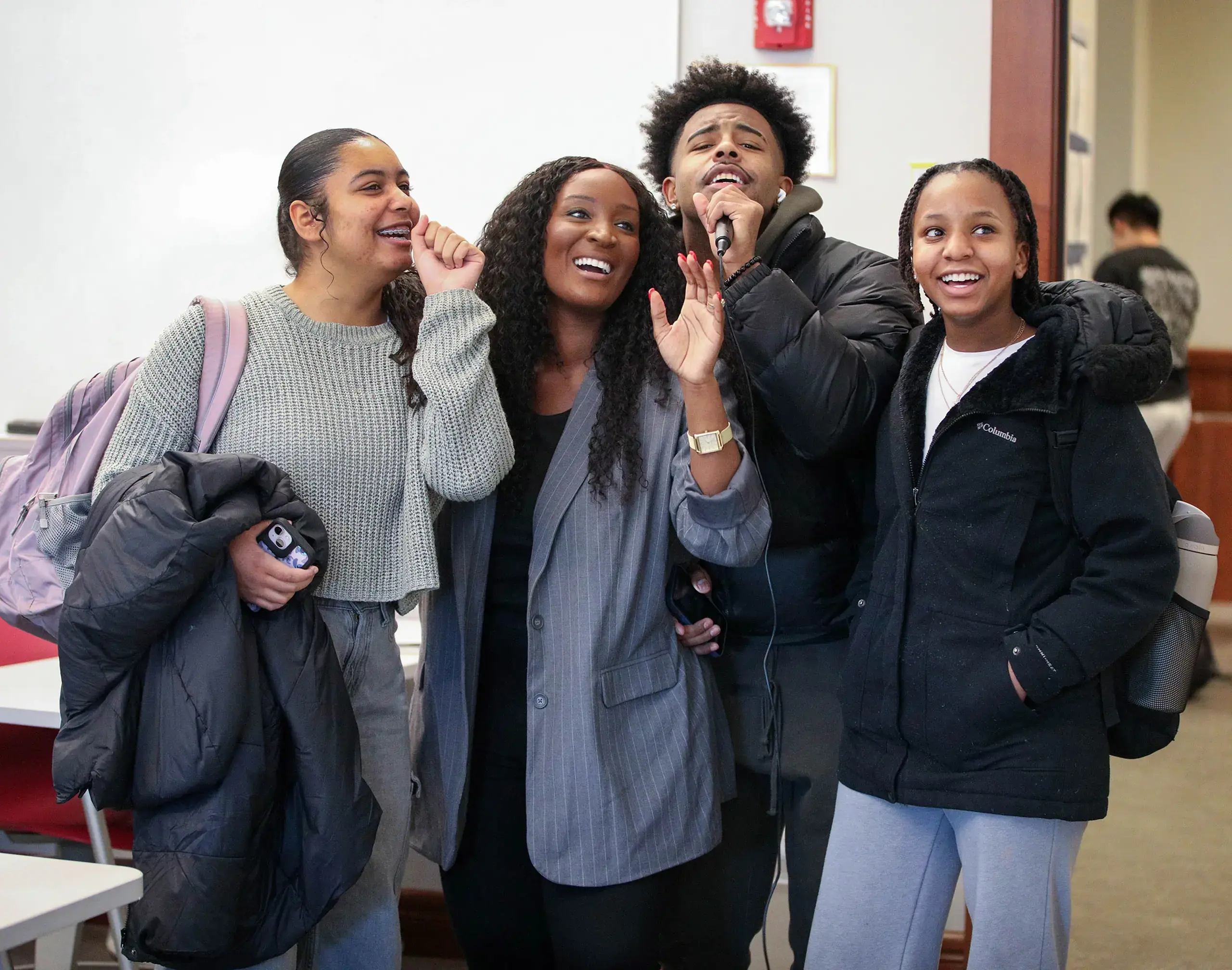 Students and DEI Director singing karaoke to celebrate Lunar New Year.