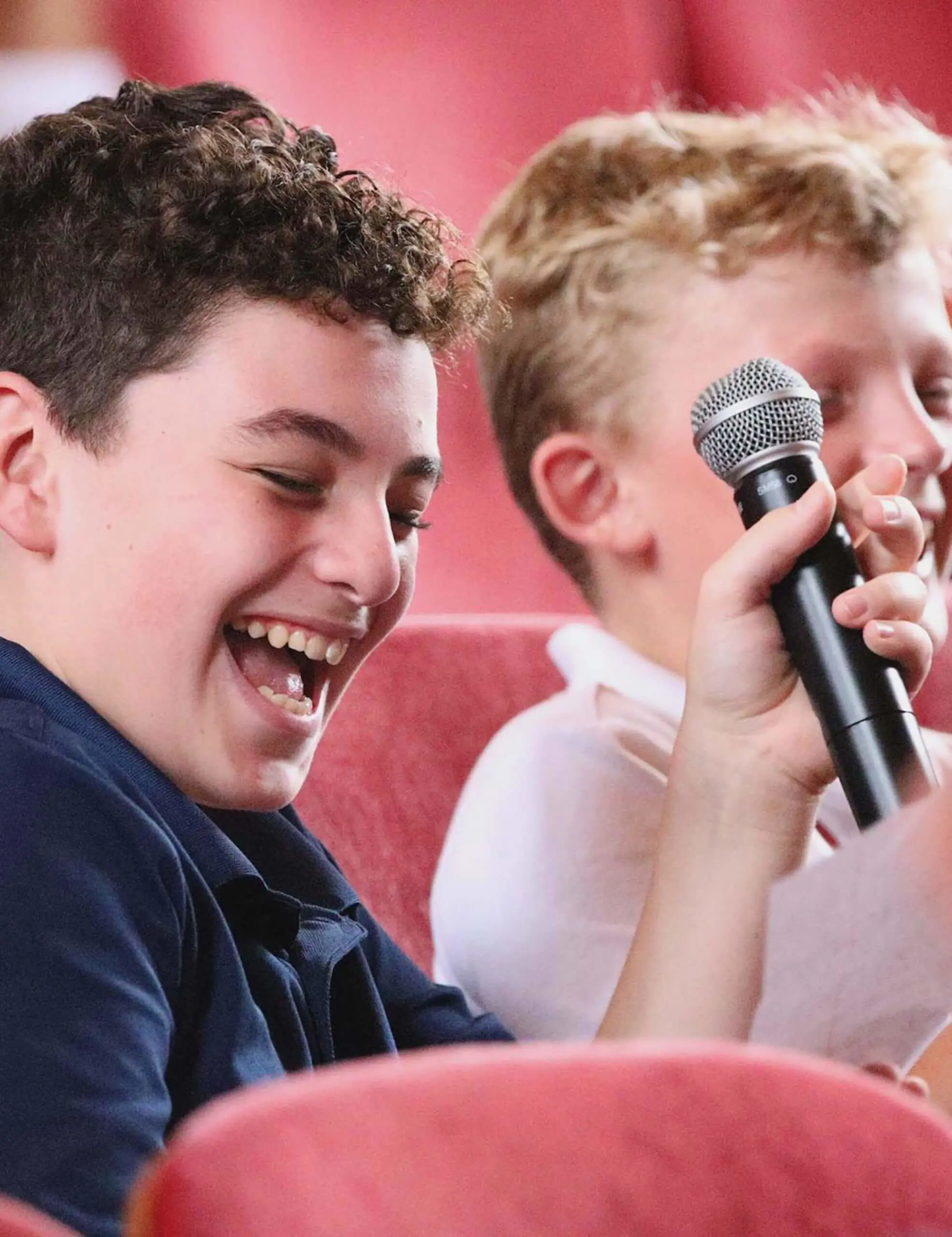 Worcester Academy Middle School students laughing with microphone