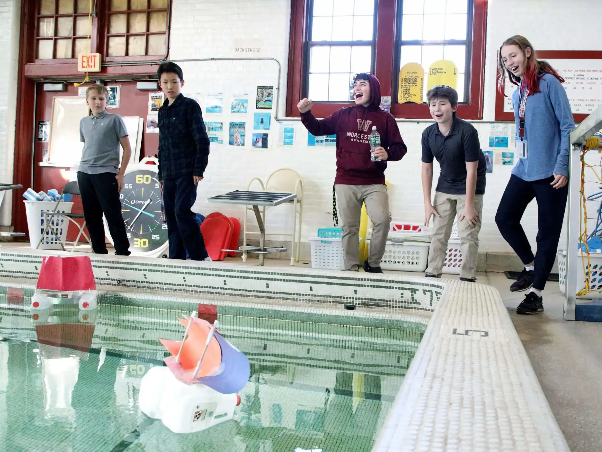 Worcester Academy Middle School students conducting a boat race as part of a science experiment