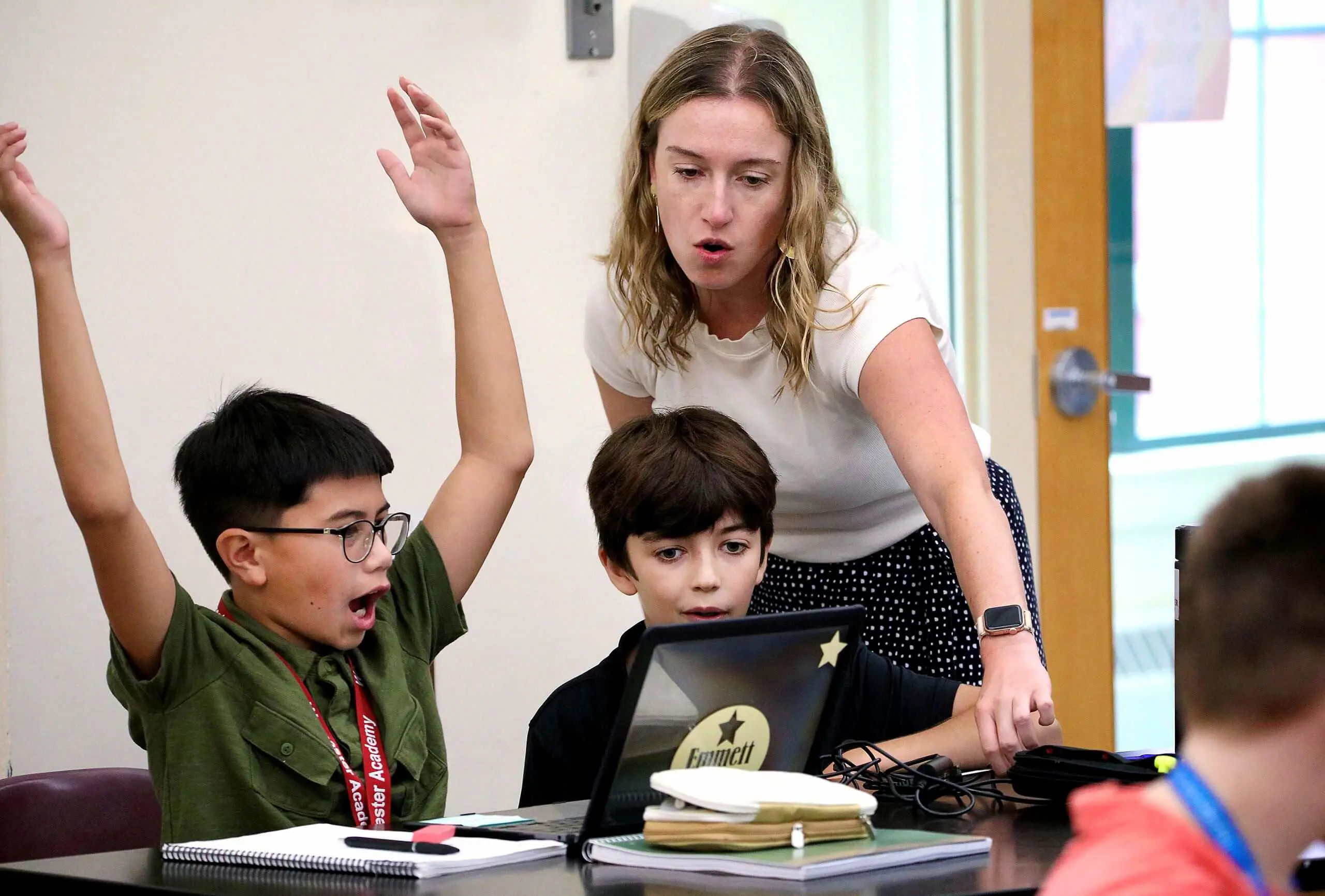 Worcester Academy Middle School teacher and students in a science class.