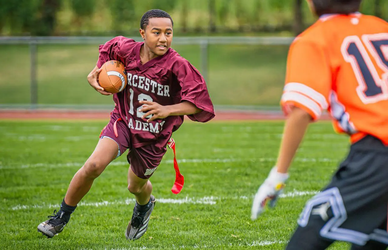 Worcester Academy Student playing flag football.