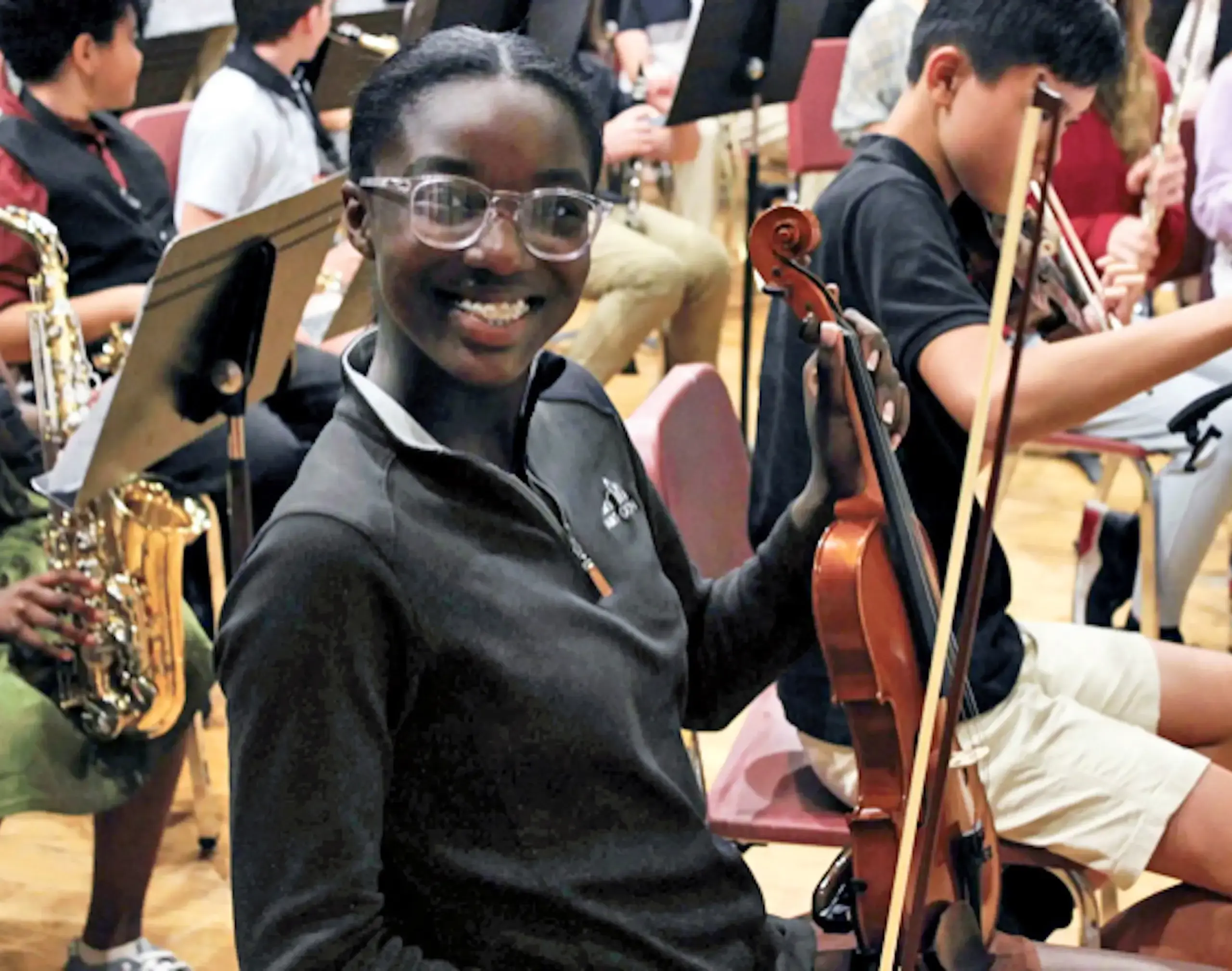 Middle School Student playing violin at a concertContent - Landscape Image,Music