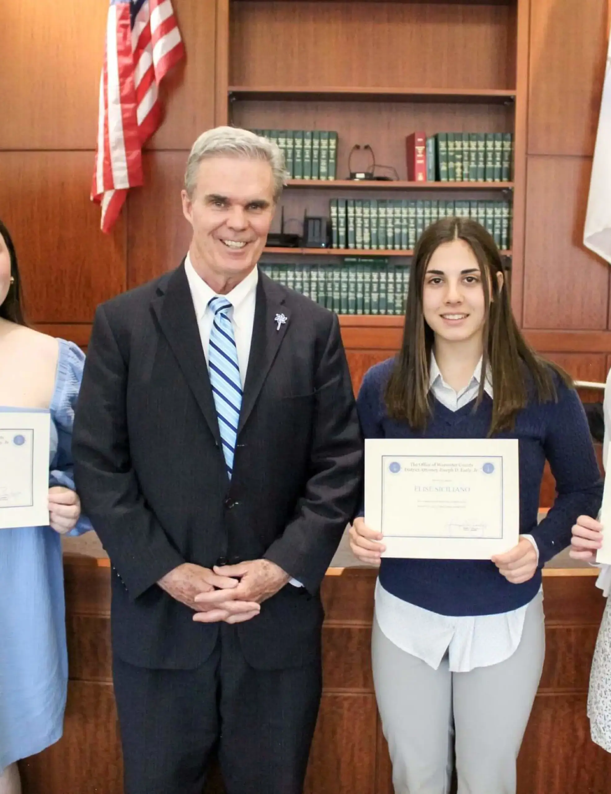 Upper School students receiving certificates for their internships with Joseph D. Early Jr. at the Worcester County District Attorney's Office.