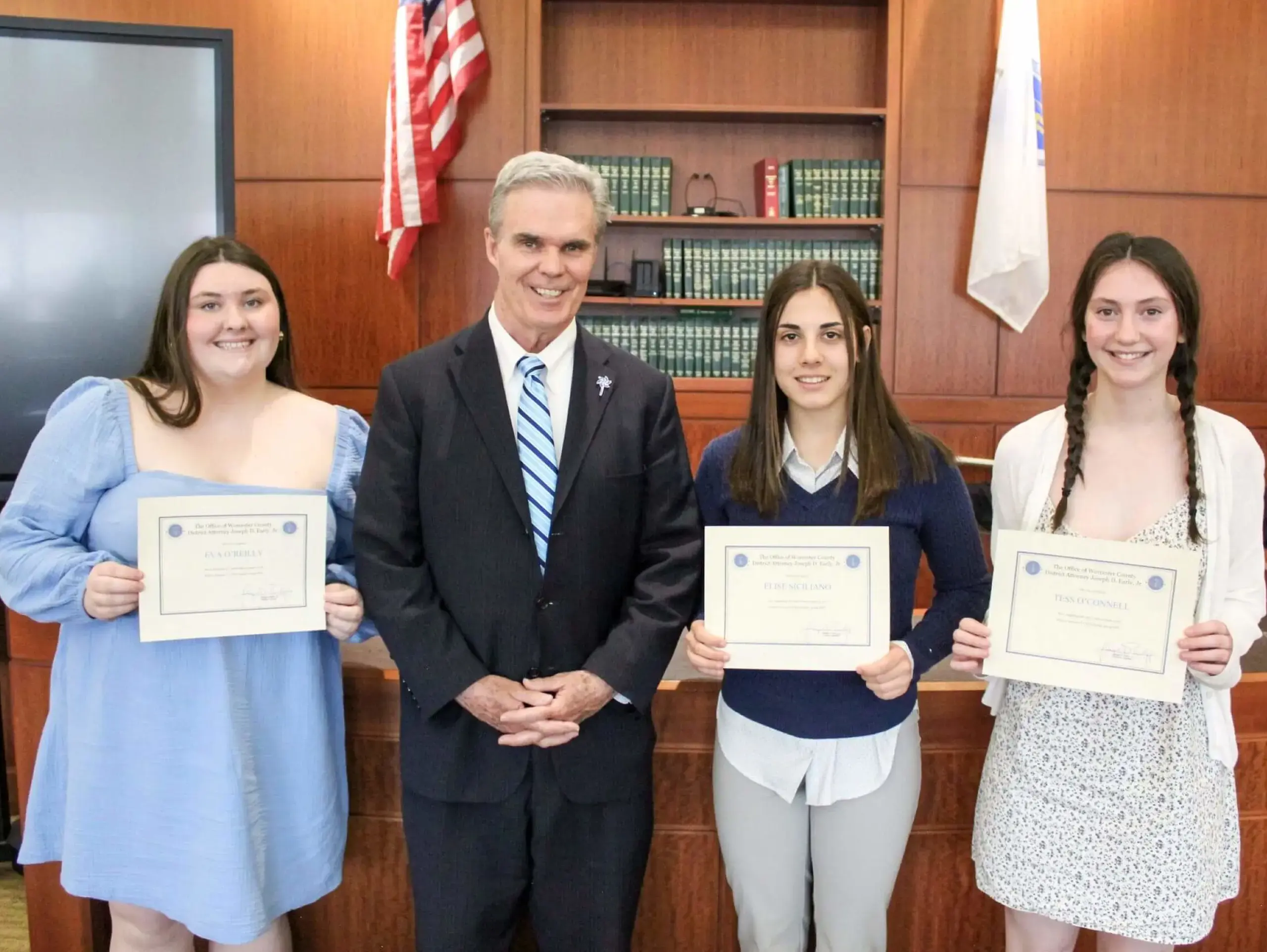 Upper School students receiving certificates for their internships with Joseph D. Early Jr. at the Worcester County District Attorney's Office.