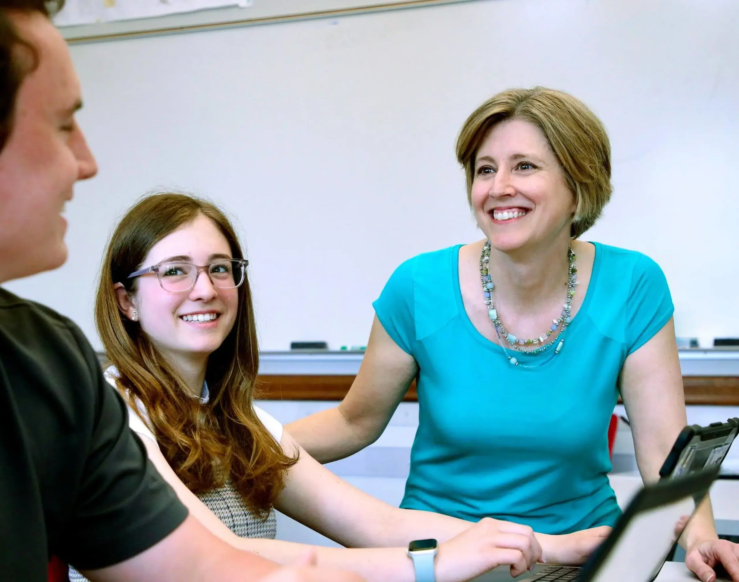 Worcester Academy History Teacher working with students in a class