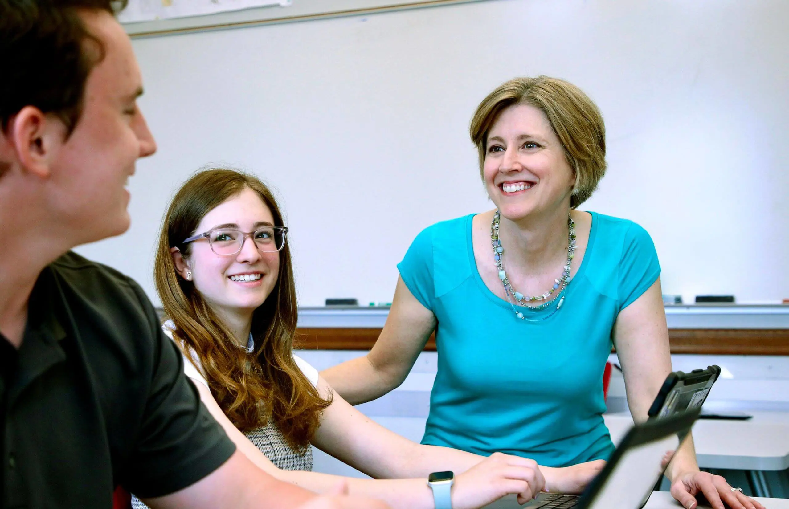 Worcester Academy History teacher working with students in a class