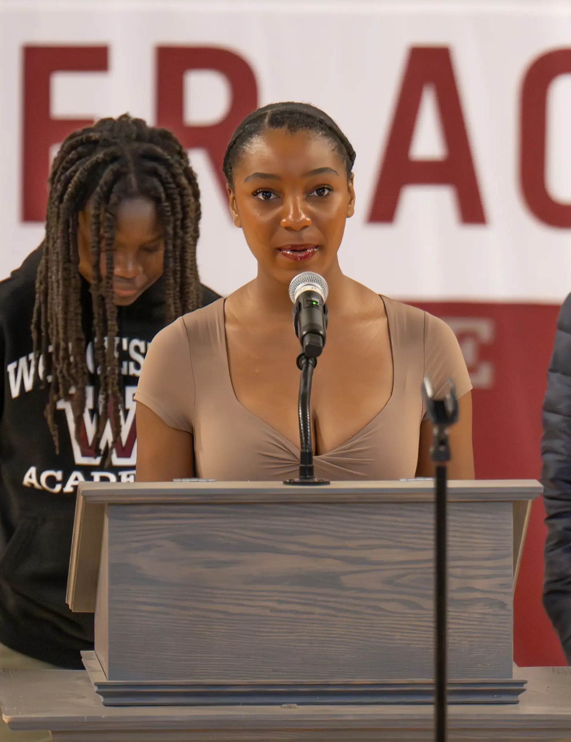 Samara Masiki ’25 standing at a podium. 