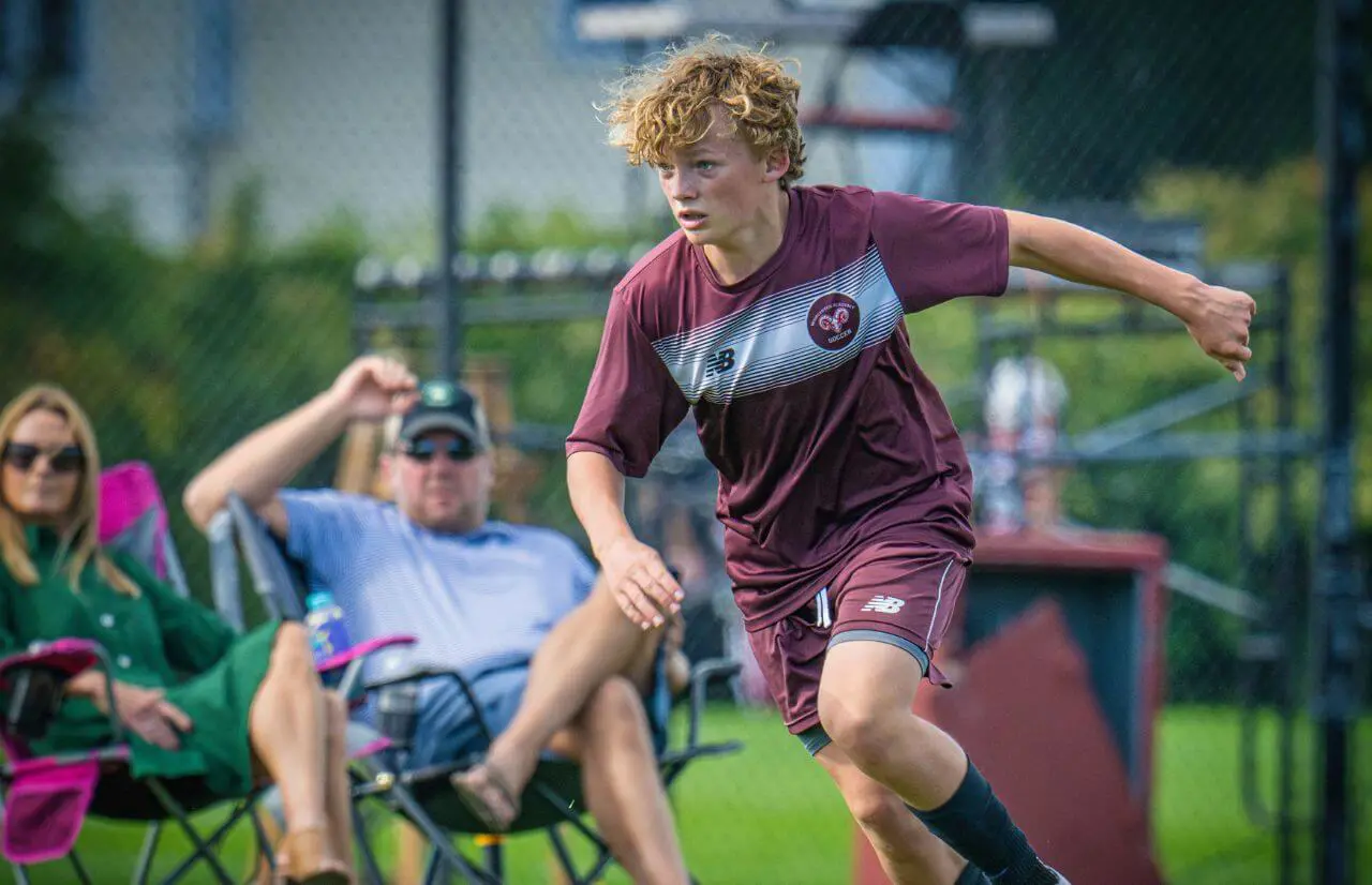 Worcester Academy Student playing soccer.