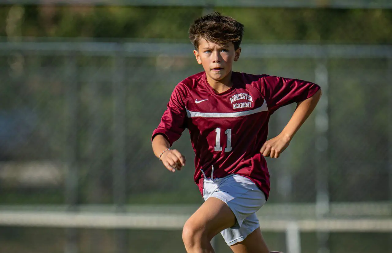 Worcester Academy Student playing soccer.