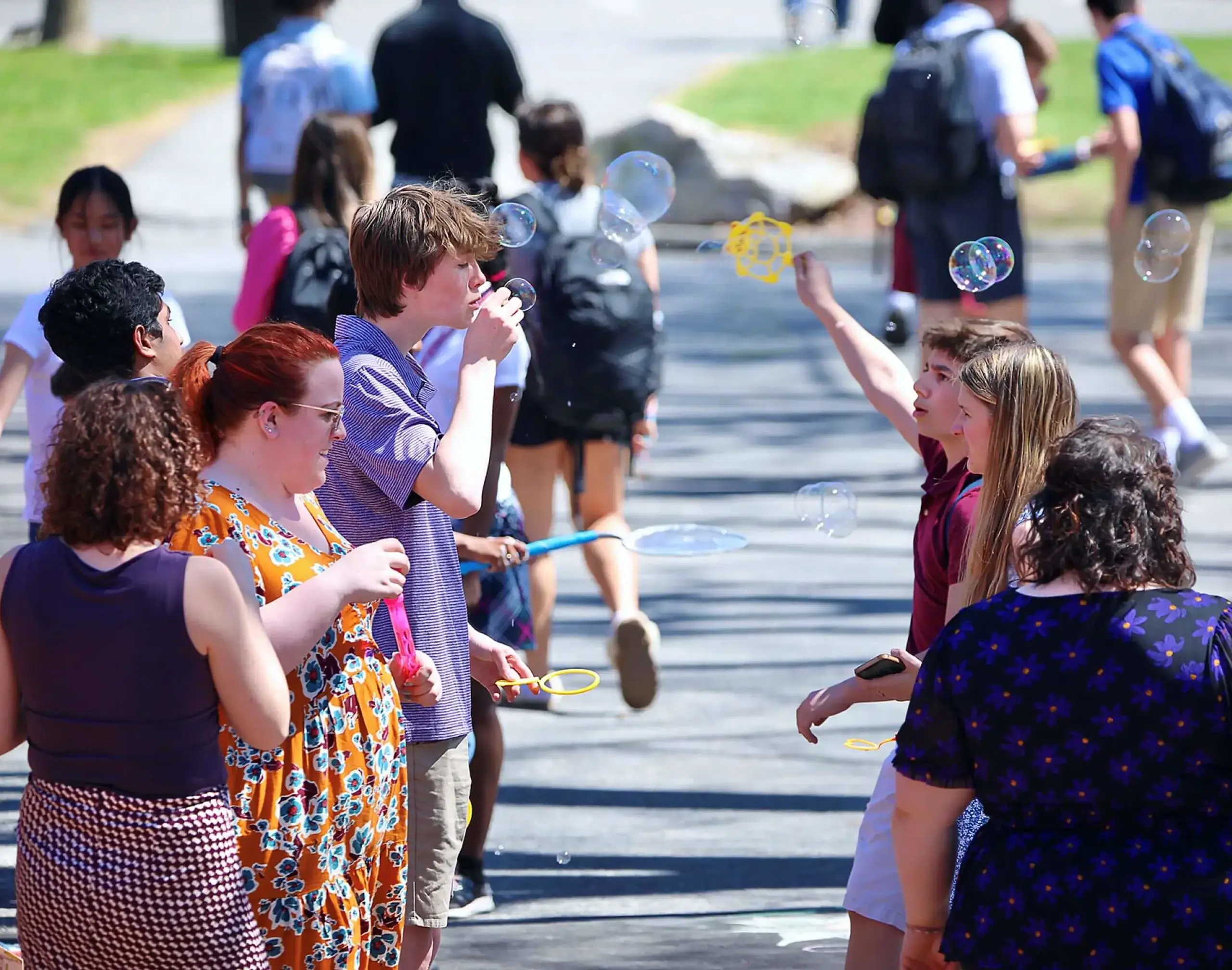 Worcester Academy students outside blowing bubbles