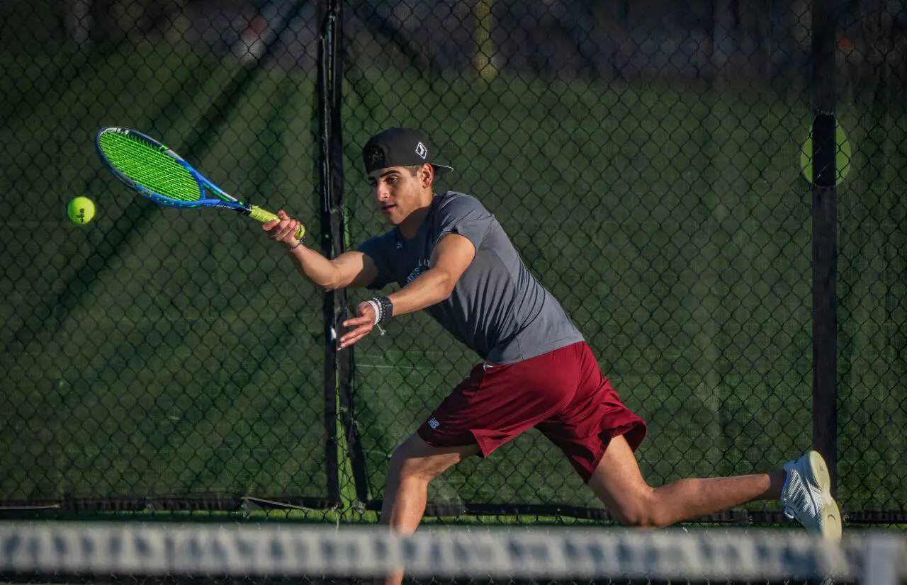 Worcester Academy Student playing tennis.