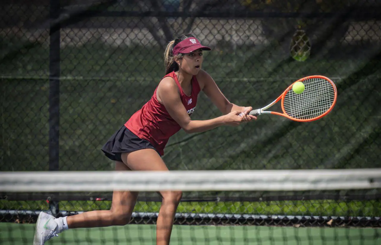 Worcester Academy Student playing tennis.