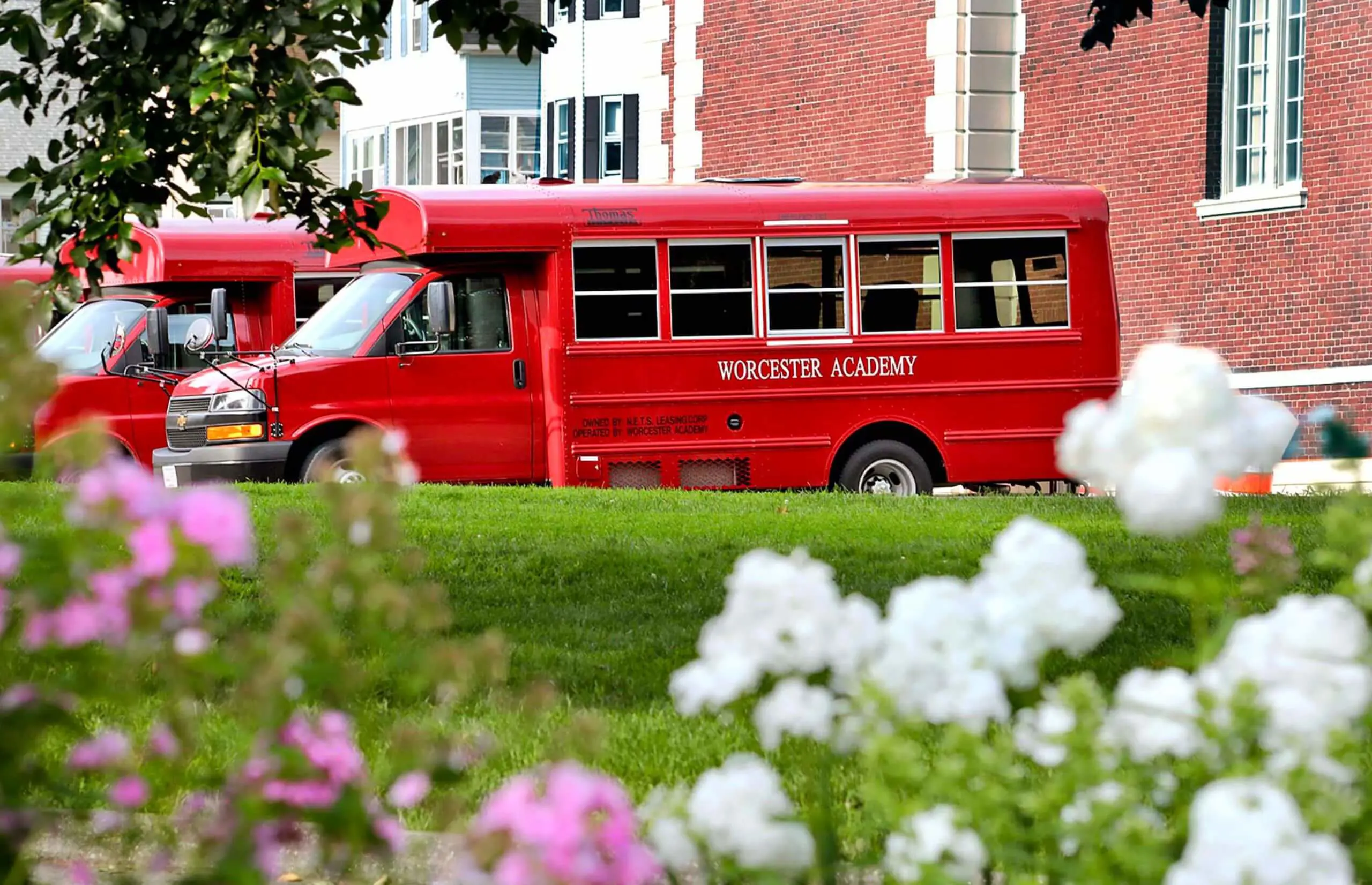 Worcester Academy school busses with flowers