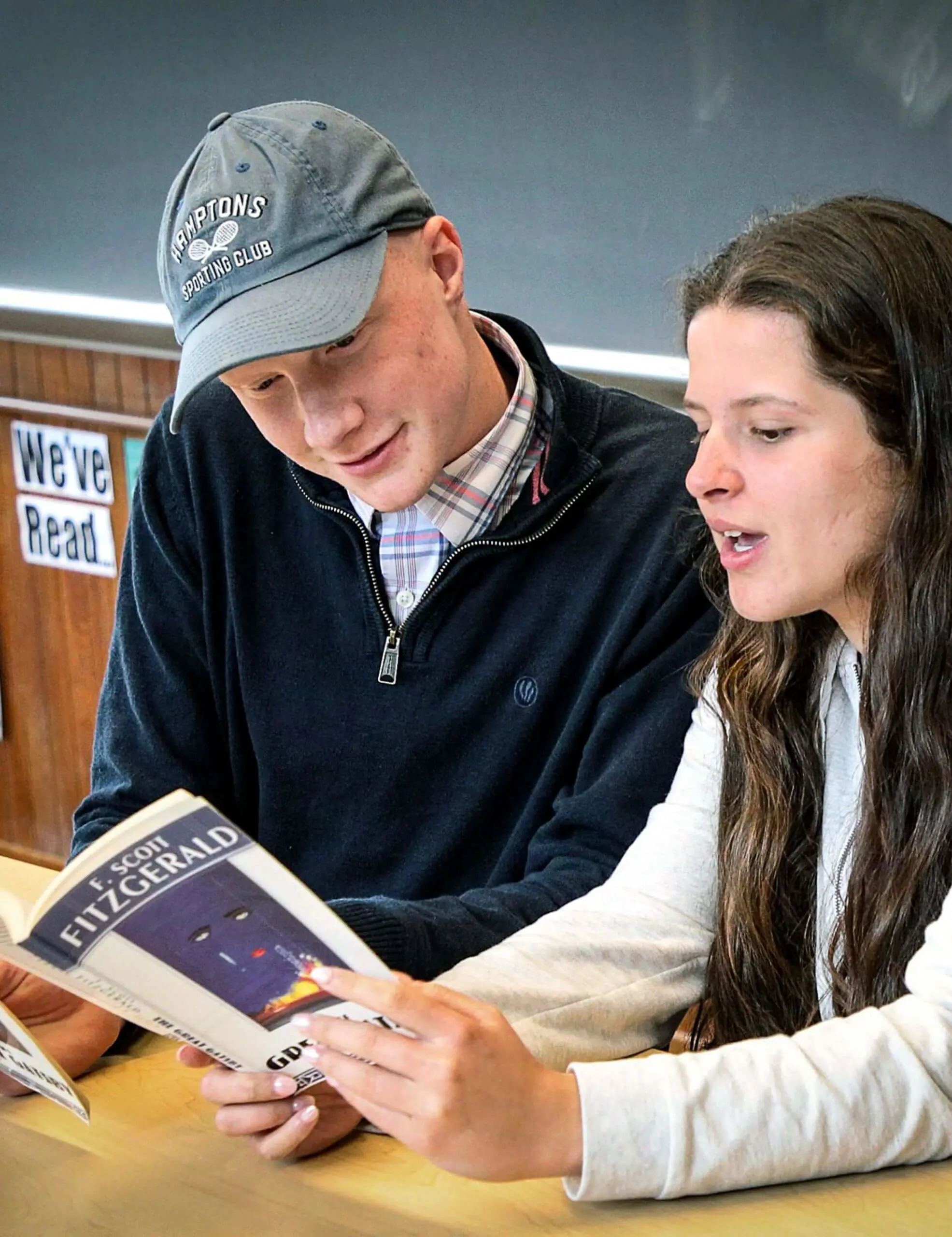 Worcester Academy Upper School English students reading 'The Great Gatsby' by F. Scott Fitzgerald together in class.