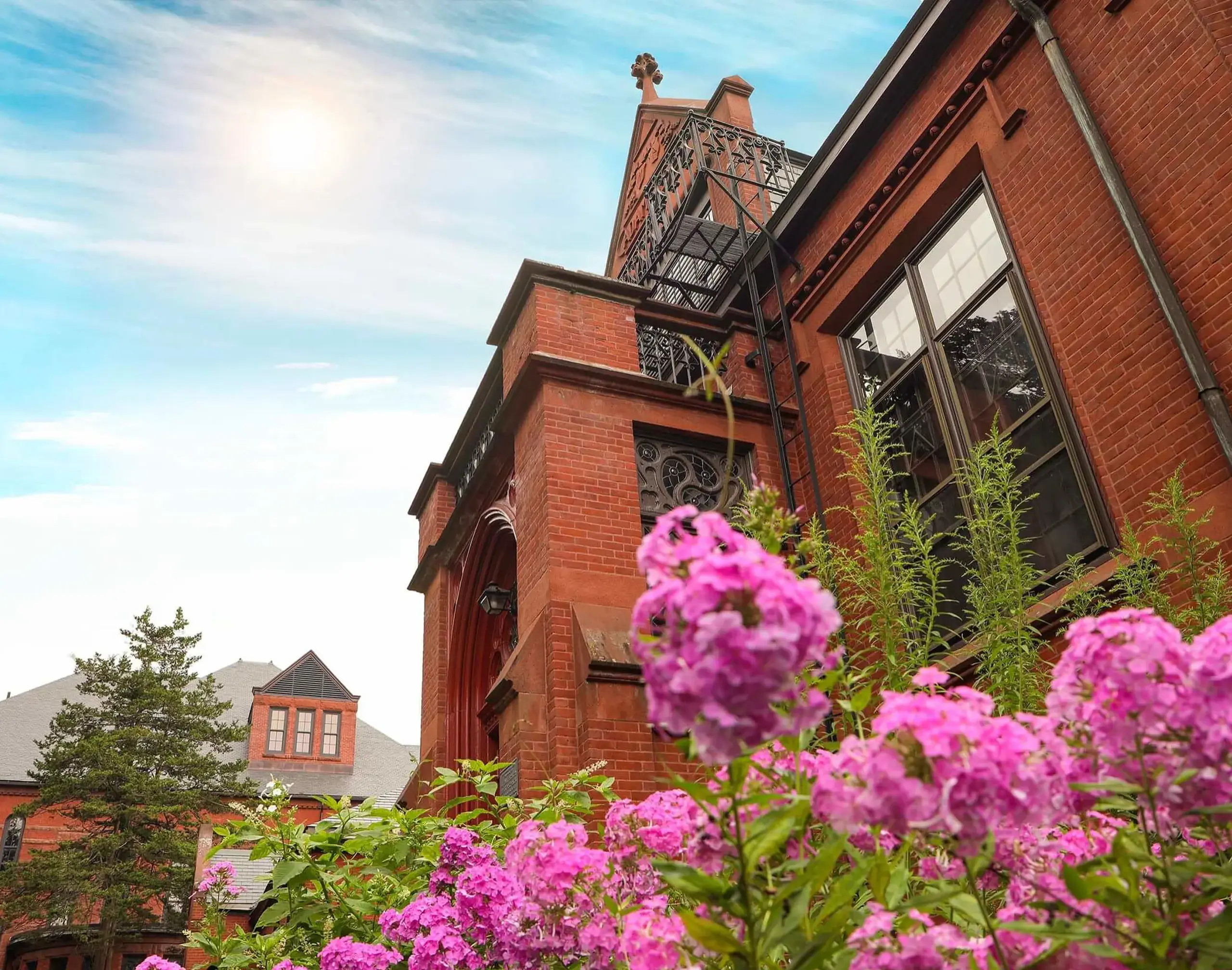 Worcester Academy view of building with pink flowers