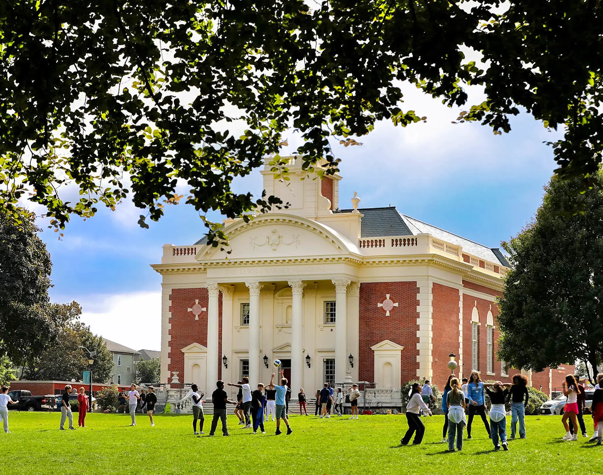 MS students on the quad at recess with the Warner building in the background.